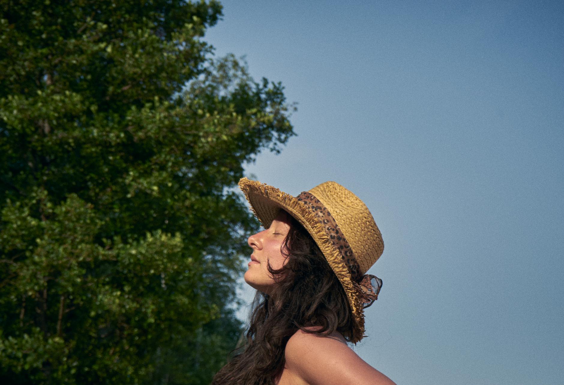 a woman in brown hat