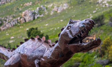 photograph of a brown dinosaur sculpture